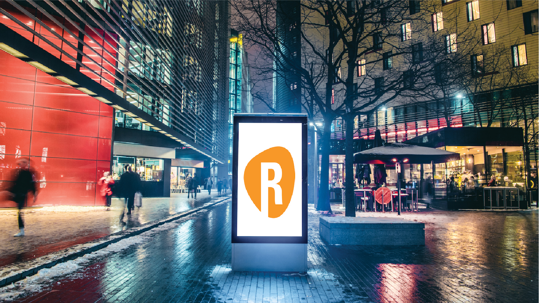 Image of a night street with a digital ad screen with Element R logo